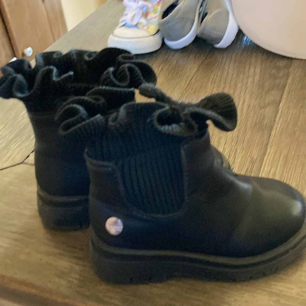 Black ankle booties with ruffle detail